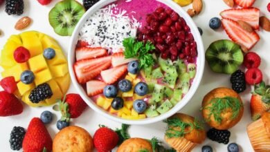 assorted sliced fruits in white ceramic bowl