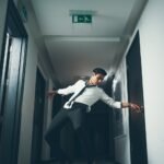 man break dancing on hallway