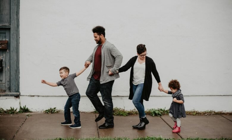 family of four walking at the street