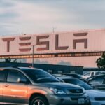 cars parked in front of company building