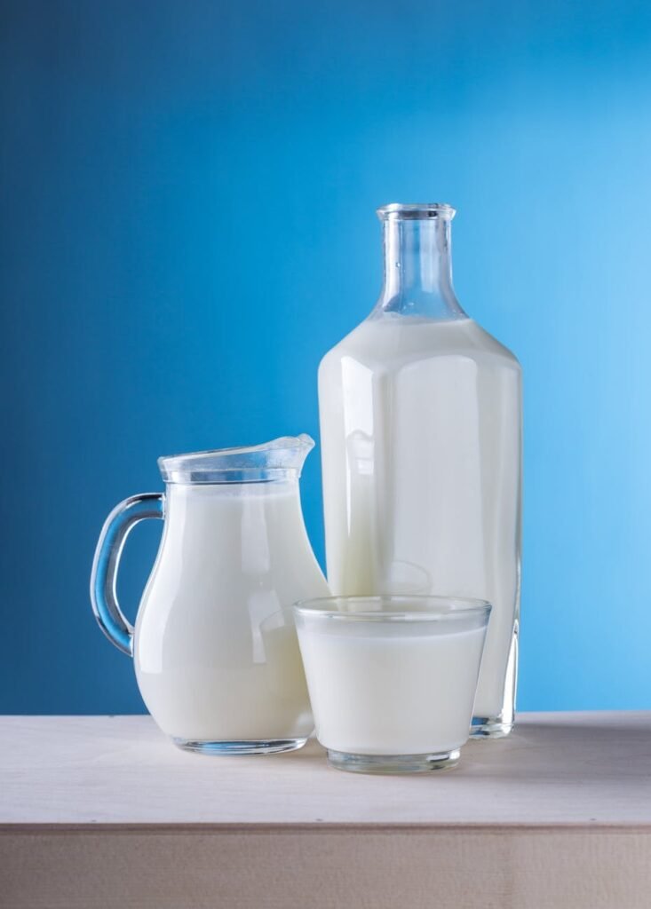 close up of milk against blue background