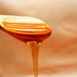 brown wooden spoon with honey