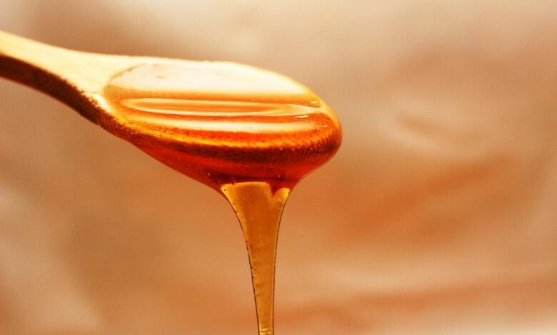 brown wooden spoon with honey