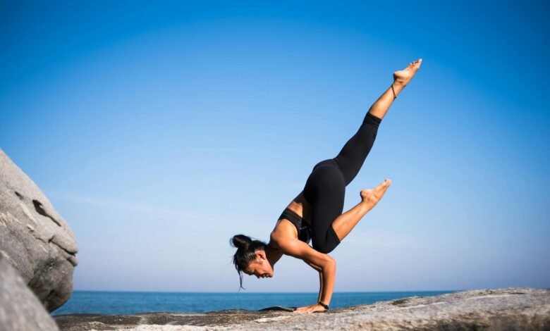 low angle view of woman relaxing on beach against blue sky