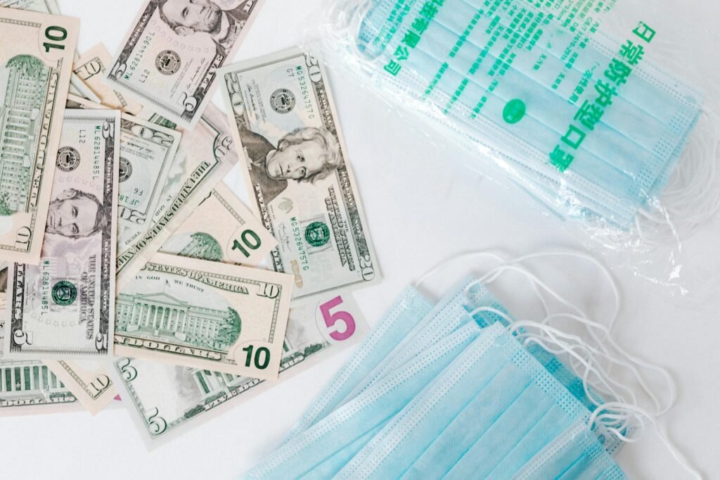 set of american cash money and medical facial masks