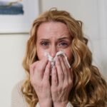 woman suffering from her allergy