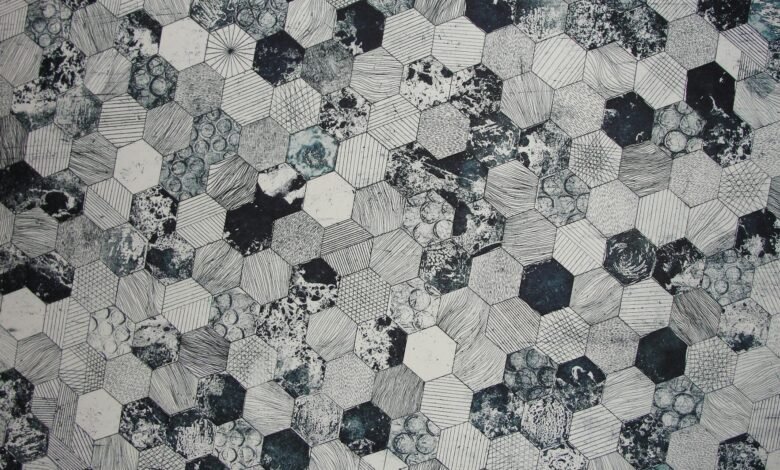 gray and black hive printed textile