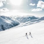 two man hiking on snow mountain