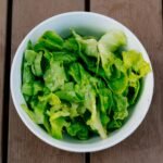 green vegetable in white bowl