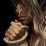 woman with tied hands