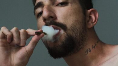 man smoking tobacco inside room