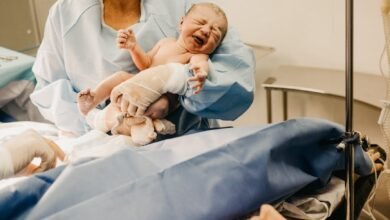 woman carrying baby