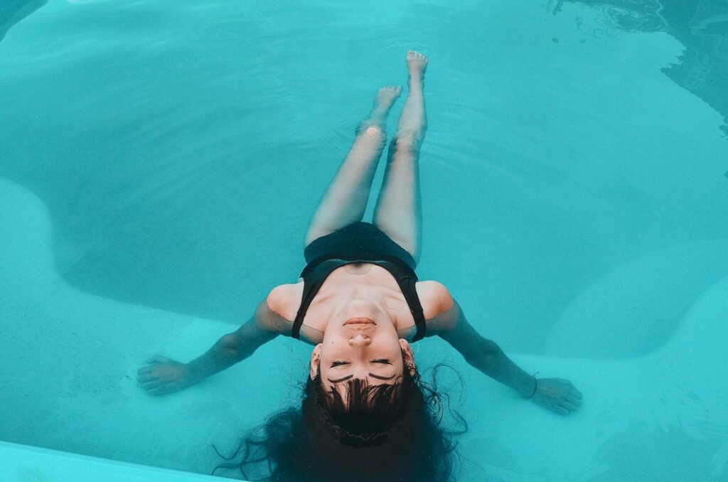 woman in black tank top in water