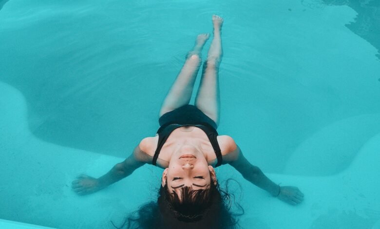 woman in black tank top in water