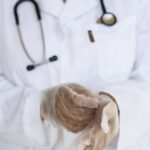 crop doctor with stethoscope preparing for surgery in hospital