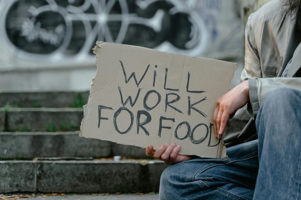 person holding a cardboard poster