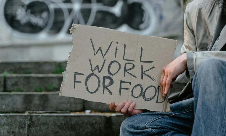 person holding a cardboard poster